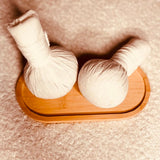 Massage aux pochons chauds d'herbes aromatiques - 60min